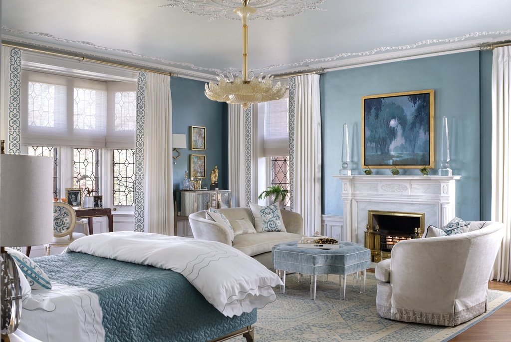 Blue bedroom with embroidered drapery borders
